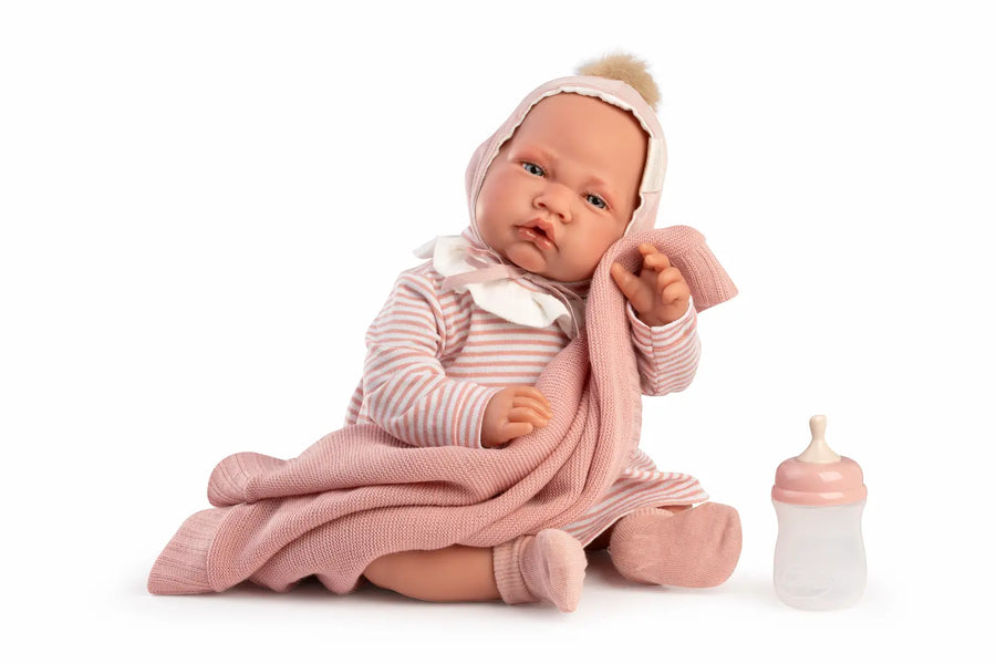 Muñeca Recién Nacida Lúa de Antonio Juan con gorro de pompón, vestido de rayas rosa, mantita y biberón