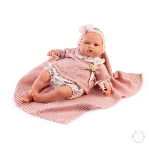 Muñeca hiperrealista con ropa rosa y certificado

