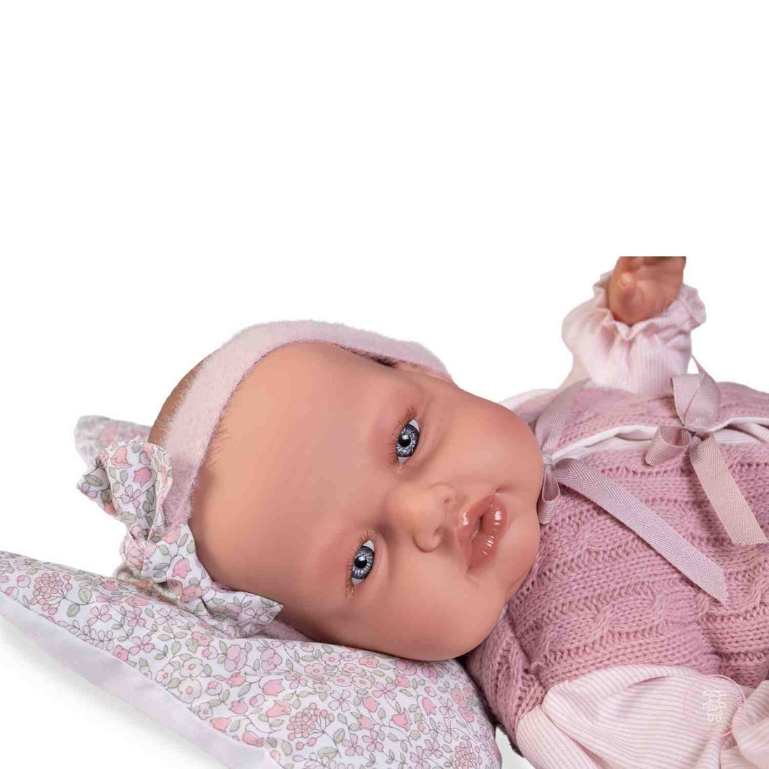 Babydoo con chaleco rosa y cojín

