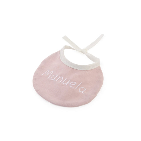 Babero rosa bordado con el nombre Manuela